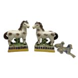 Pair of 20th century Staffordshire style figures of horses