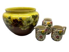 Victorian Leeds Art Pottery jardiniere decorated with flowers and foliage on a brown and yellow merg