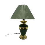 Table lamp of baluster form decorated in mottled green with gilt mounts and banding