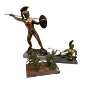 Bronzed Roman soldier figure on a marble base together with two similar smaller