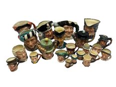 Large group of character jugs and novelty teapots