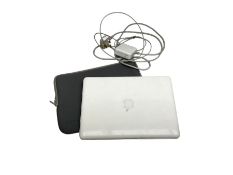 2009 Macbook with charger and second skin case