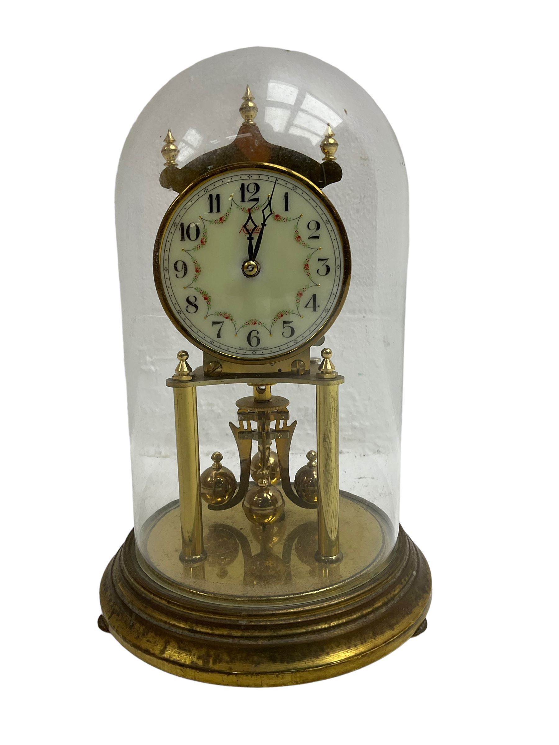 Kendo torsion clock with a glass dome