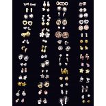 Sixty pairs of stud earrings including bow