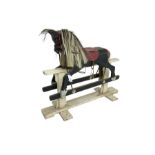 20th century black painted rocking horse on white painted trestle base