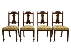 Set four late 19th century carved walnut dining chairs