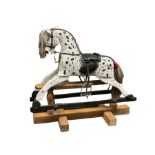 Small black and white painted rocking horse