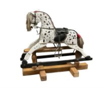 Small black and white painted rocking horse