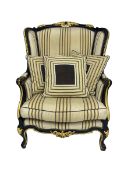 Thomas Messel - Georgian style ebonised and gilt wingback armchair