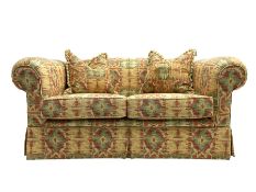 Two seat traditional shape sofa upholstered in Kilim print fabric