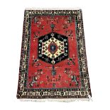 Persian red ground rug