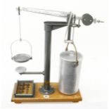 A precision balance by S & P (Scientific & Projections) London c/w set of brass weights used in a