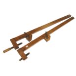 A pair of wood sash cramps stamped AUX MINES DE SUEDE, for 4'6" work, one damaged screw thread o/w