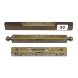 Two 6" steel and brass levels by STANLEY and DAVIS and an 8" rosewood level by HOWARTH G+