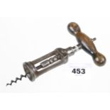 An unusual corkscrew that automatically reverses when screwed into the cork G+