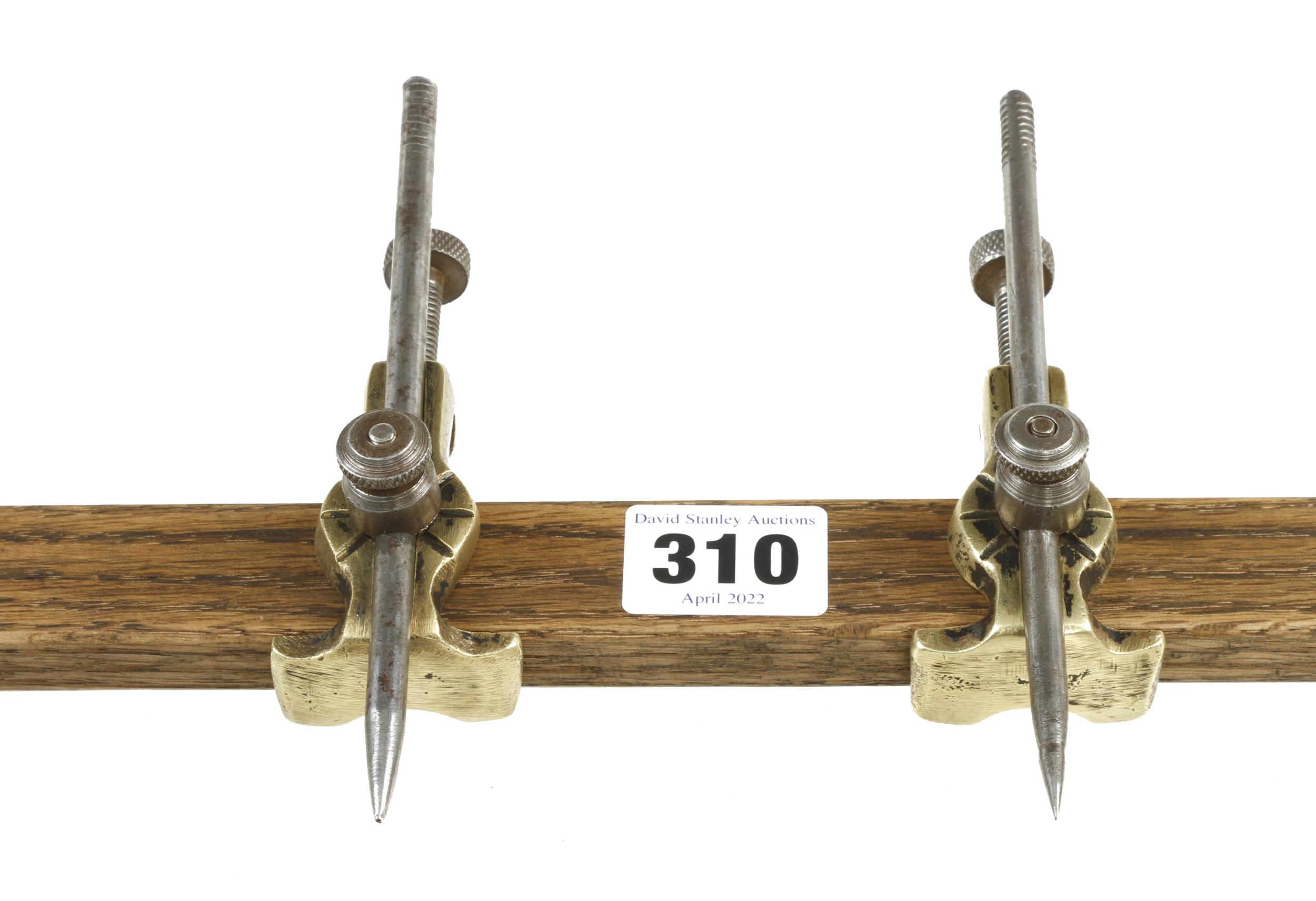 A pair of brass trammels with adjustable steel points G