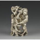 An ivory okimono of a group of 4 monkeys picking fruit into a basket 4"h G++