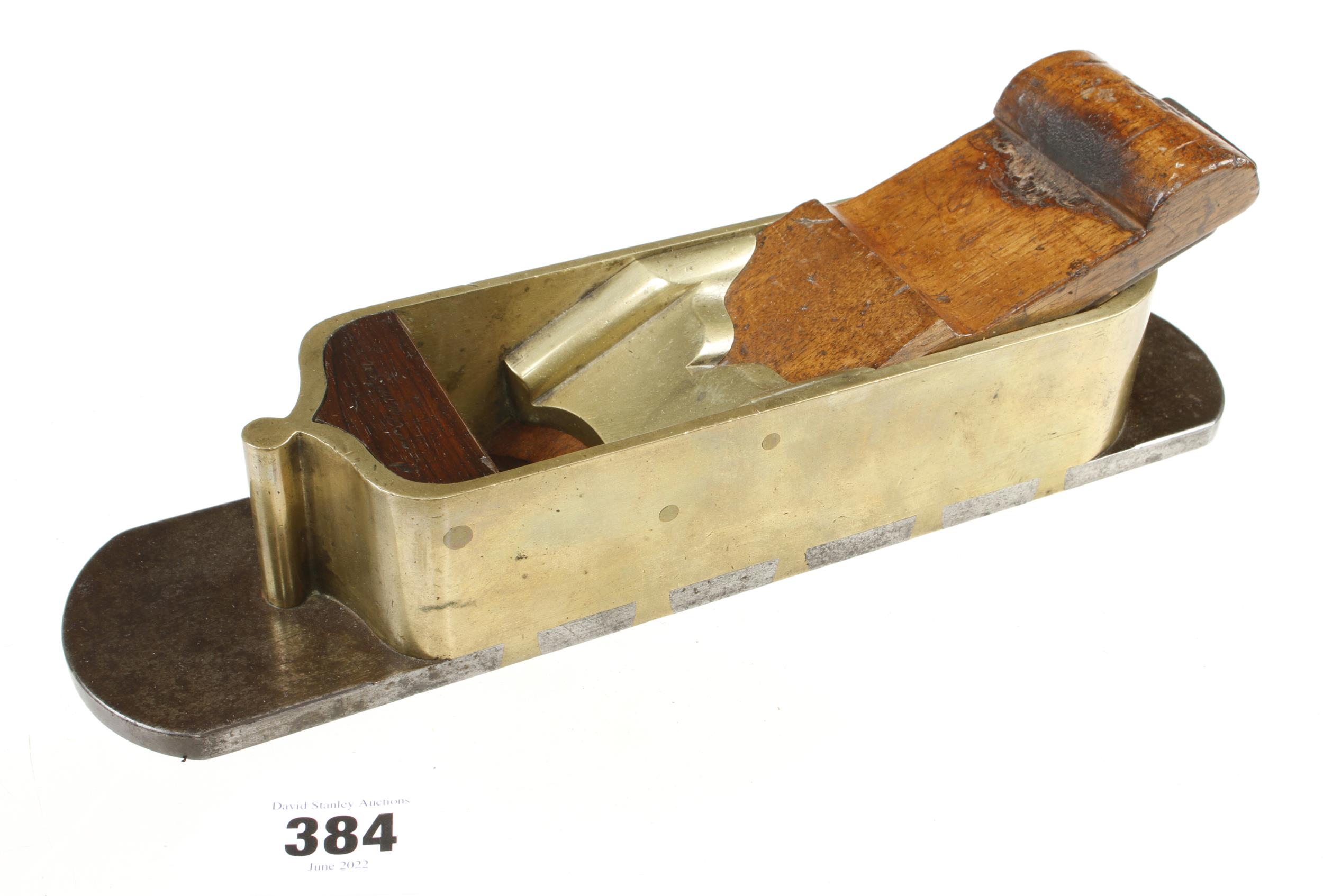 A rare, fine quality brass mitre plane 12" x 2 3/4" d/t steel sole and rosewood infill and wedge,