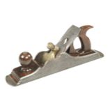 A fine quality 16 1/2" Scottish iron panel plane with stepped and moulded toe and heel with rosewood