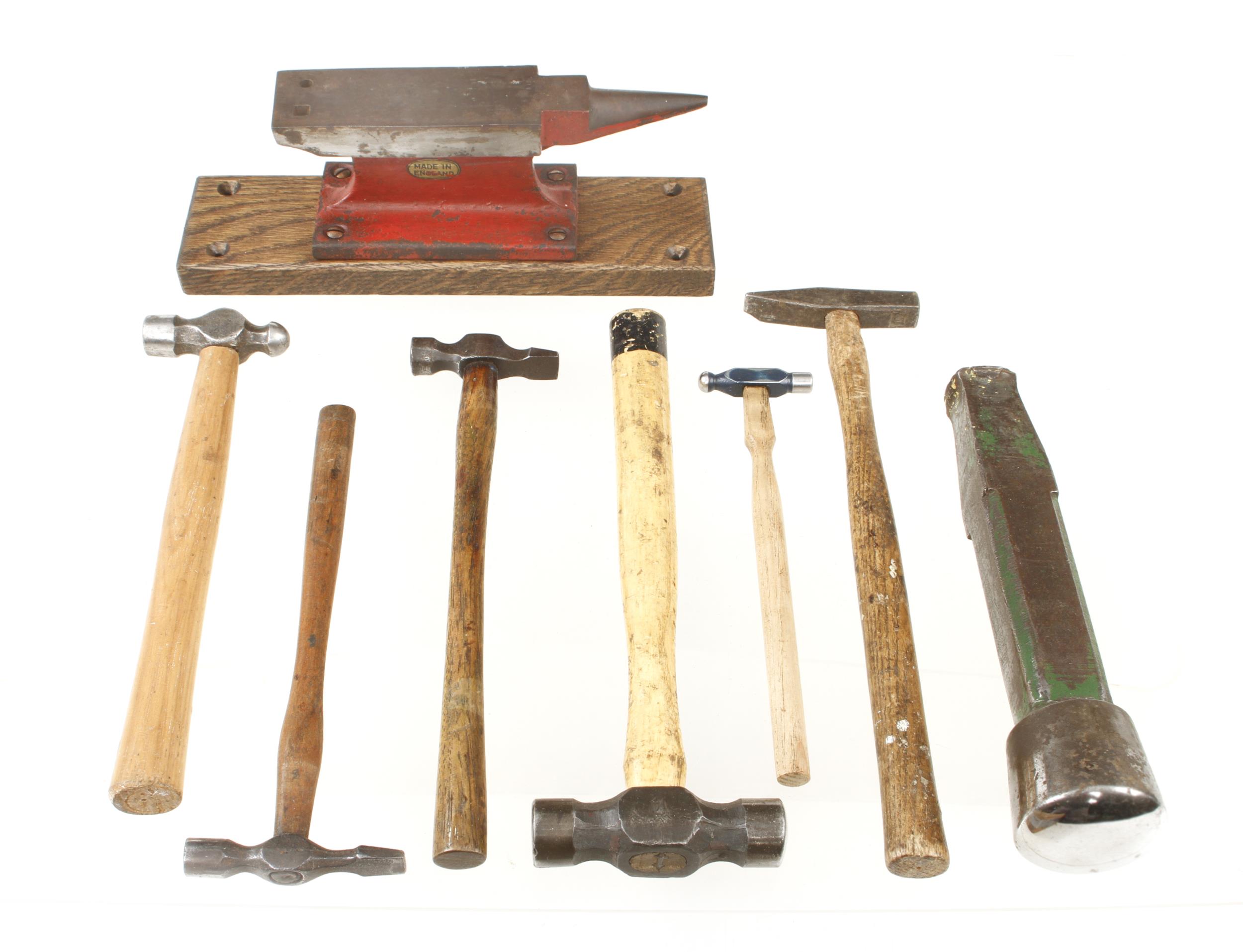 Six panel beater's hammers, a small anvil and a stake G