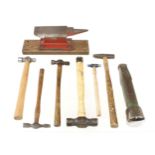 Six panel beater's hammers, a small anvil and a stake G