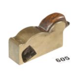 A brass bullnose plane 3 1/2" x 1 1/4" with rosewood wedge, small chip to mouth and wrong iron G