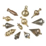 Seven brass plumb bobs and 5 in steel G+