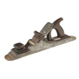 A nice quality 17" Scottish iron panel plane with stepped toe and heel, rosewood infill and handle