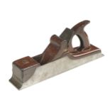 A quality iron panel plane 14" x 2 1/2" with mahogany infill, closed handle and scrolled wedge G++