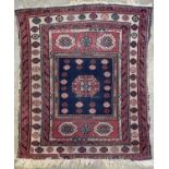 An Isparta rug, West Anatolia, circa 1920, the central indigo field with an octagonal polychrome