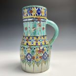 A Moroccan pottery jug, 19th century, decorated with geometric and stylised flowerhead motifs,