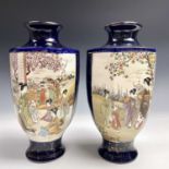 A pair of Japanese hexagonal satsuma vases, early 20th century, with figures in a garden setting,