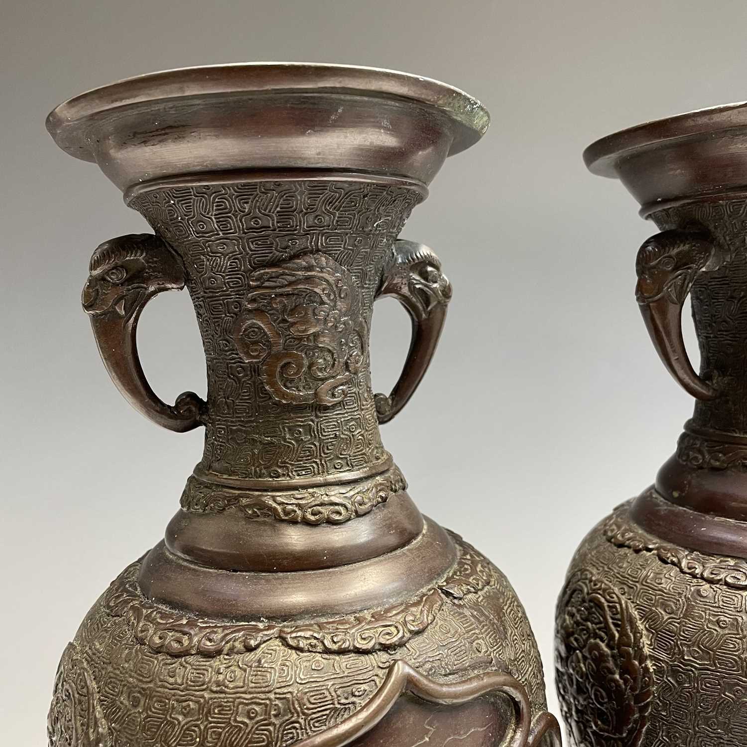 A pair of Japanese bronze twin-handled vases, Meiji period, seal mark, relief decorated with - Image 6 of 12