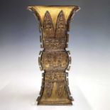 A Chinese gilt bronze Gu-shaped vase, long Ming Dynasty Xuande mark to base, height 29.5cm, width