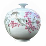 A Korean porcelain vase, 20th century, of squat form and decorated with cherry blossom, height 23.