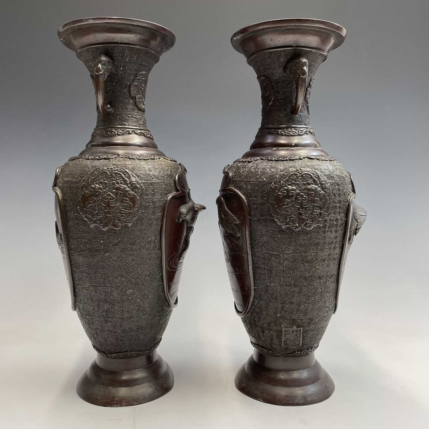 A pair of Japanese bronze twin-handled vases, Meiji period, seal mark, relief decorated with - Image 8 of 12