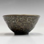 A small Chinese bronze bowl, 20th century, the outer body decorated with elephants and foliage,