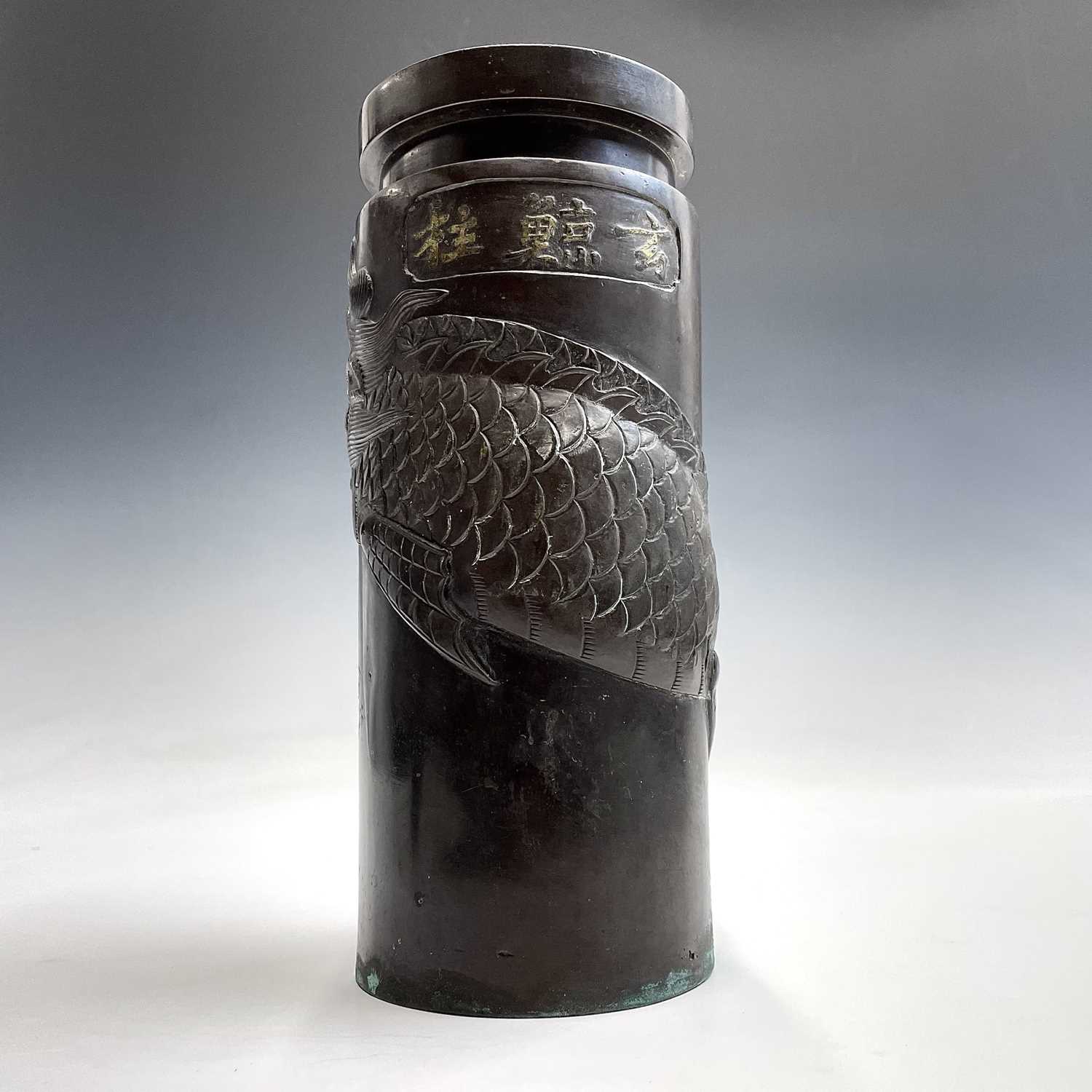 A Chinese bronze cylindrical vase, Qing Dynasty, the cartouche enclosing a five character mark above