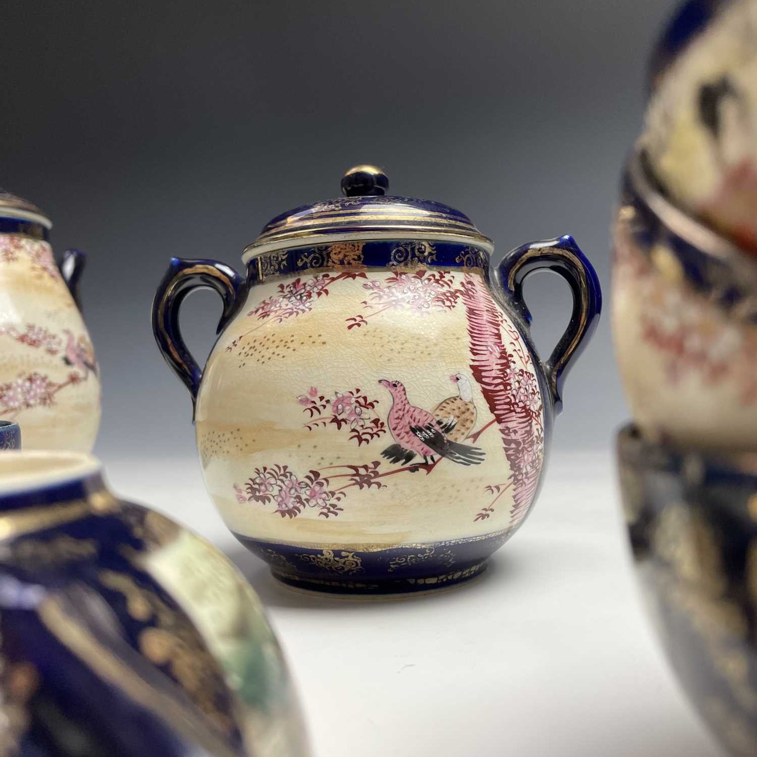 A Japanese satsuma tea service, early 20th century, comprising a teapot, hot water jug, sugar - Image 15 of 18