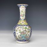 A Chinese famille rose porcelain vase, 19th century, the blue ground with flowerheads, leafs and