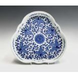 A Chinese blue and white porcelain lobed tray, 20th century, with scrolling tendrils and leaves,