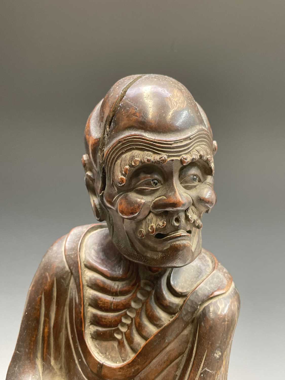 A Chinese carved rootwood figure of a man in a robe, 19th century, the figure in two sections, - Image 11 of 14