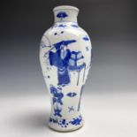A Chinese blue and white vase, circa 1900, decorated with figures holding umbrellas, fans and