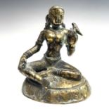 An Indian bronze figure of a seated lady holding a bird, 19th century, height 12.5cm, width 10.