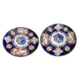 A large pair of Japanese Imari porcelain chargers, Meiji Period, the fluted borders with gilt