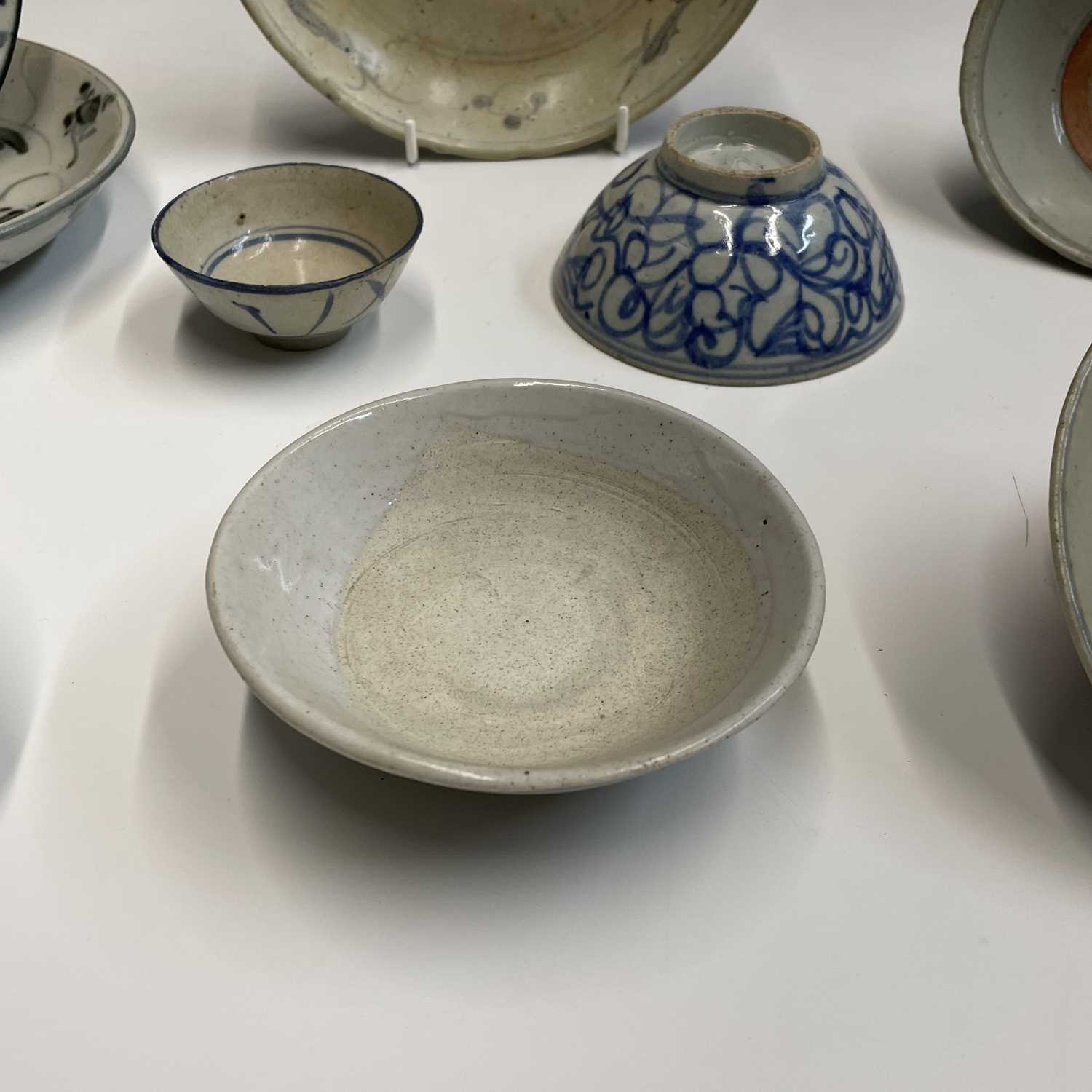 A selection of Chinese provincial pottery bowls and plates, Ming Dynasty, largest dish diameter 19. - Image 5 of 20