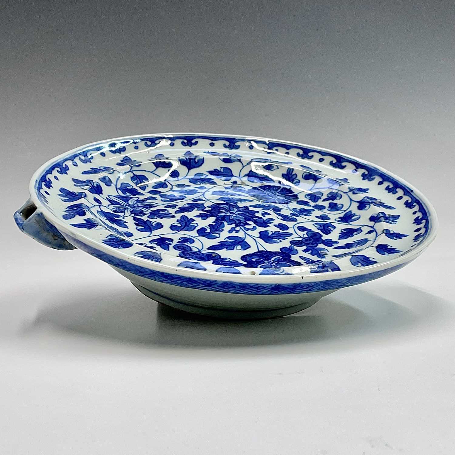 A Chinese export porcelain blue and white warming plate, late 18th century, with an all over - Image 2 of 8