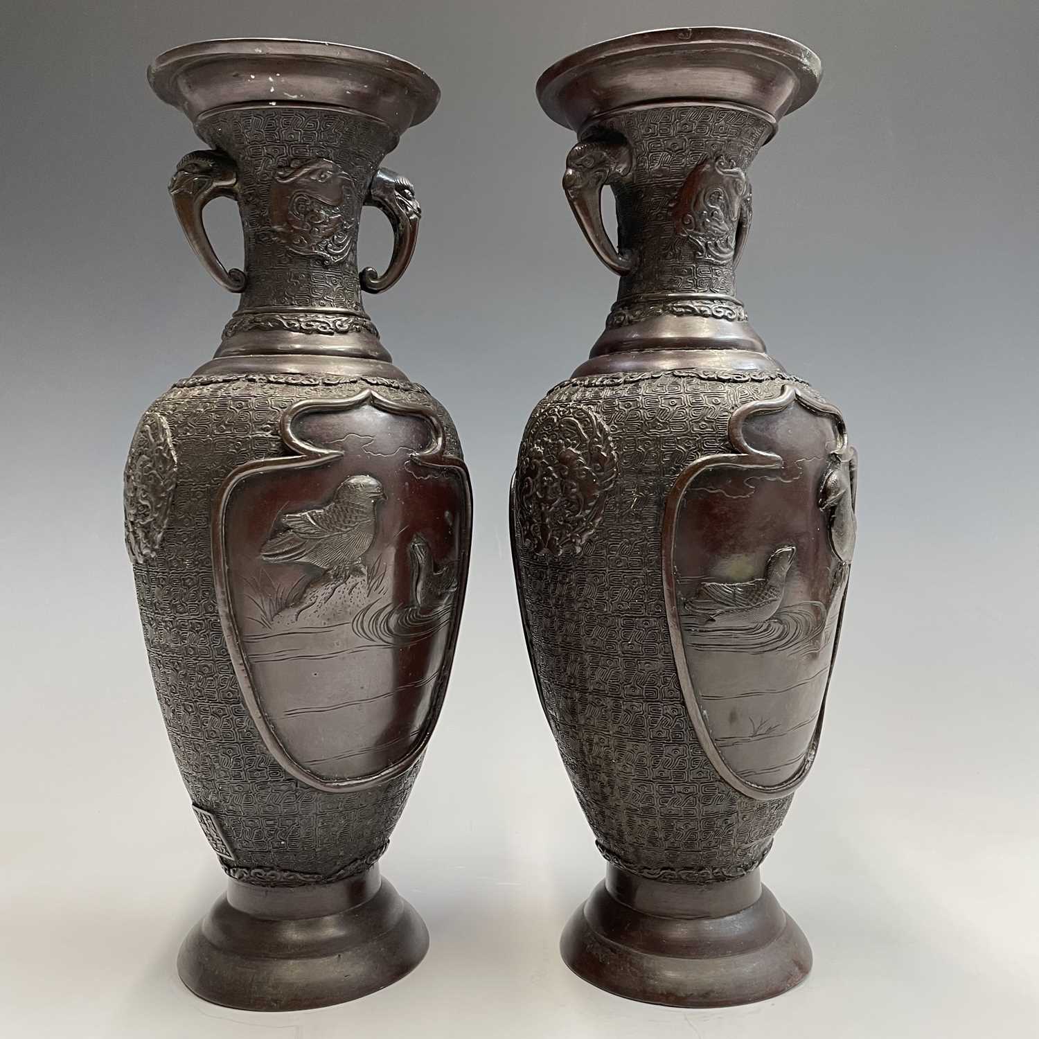 A pair of Japanese bronze twin-handled vases, Meiji period, seal mark, relief decorated with - Image 11 of 12