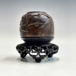 A Chinese carved wood scholars water pot, Qing Dynasty, with prunus carved decoration, rocks and