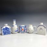 Three Chinese porcelain tea caddies, 18th century, height of tallest 12.3cm, a Chinese famille